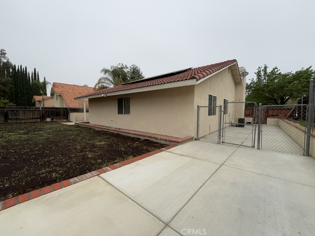9263 Owari Lane Riverside, CA 92508 - Photo 17 of 17 a backyard of a house with table and chairs