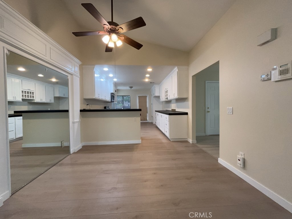9263 Owari Lane Riverside, CA 92508 - Photo 4 of 17 a view of a kitchen with a sink and a stove top oven