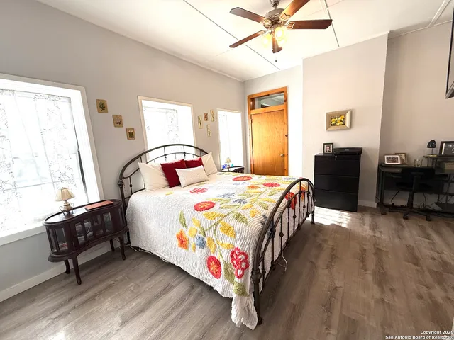 a bedroom with a bed and window