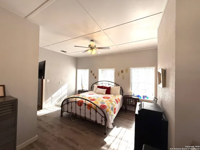 a bedroom with furniture and a chandelier