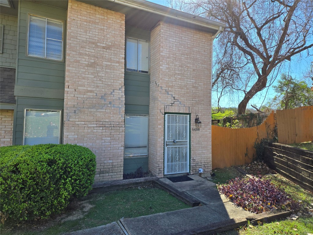 6409 Chimney Creek Circle, Unit B2 Austin, TX 78723 - Photo 1 of 1 a view of a backyard of the house