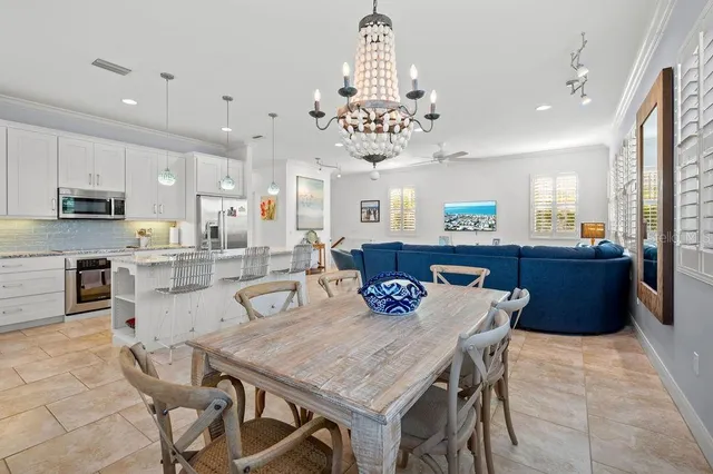 a kitchen with a sink window and cabinets