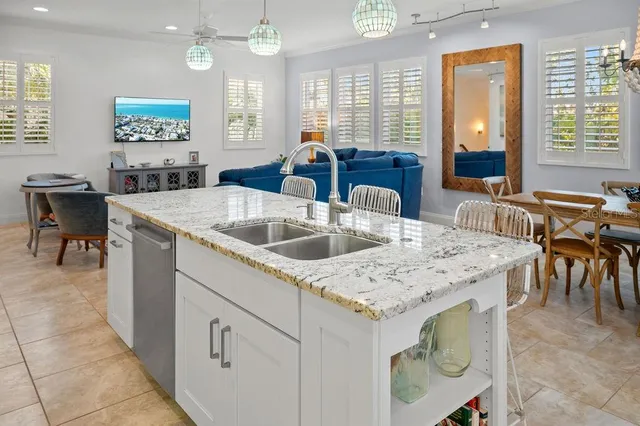 a view of a dining room with furniture and chandelier