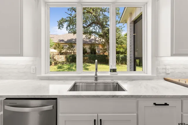 a kitchen with a sink and a window