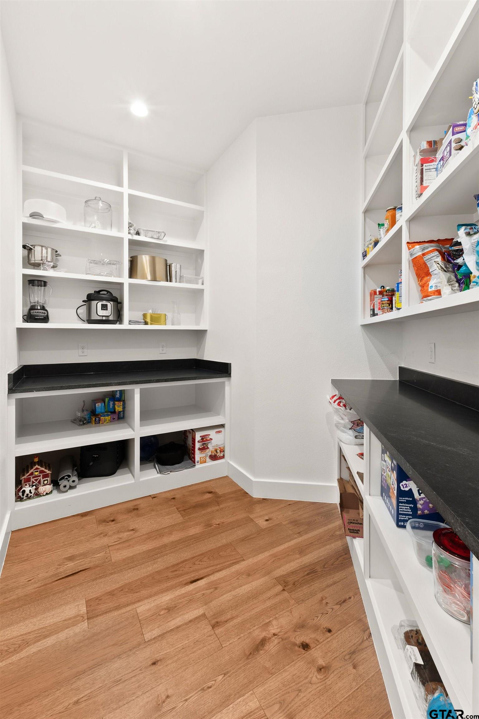 2895 Stewart Way Tyler, TX 75709 - Photo 12 of 44 a kitchen with stainless steel appliances a stove and cabinets