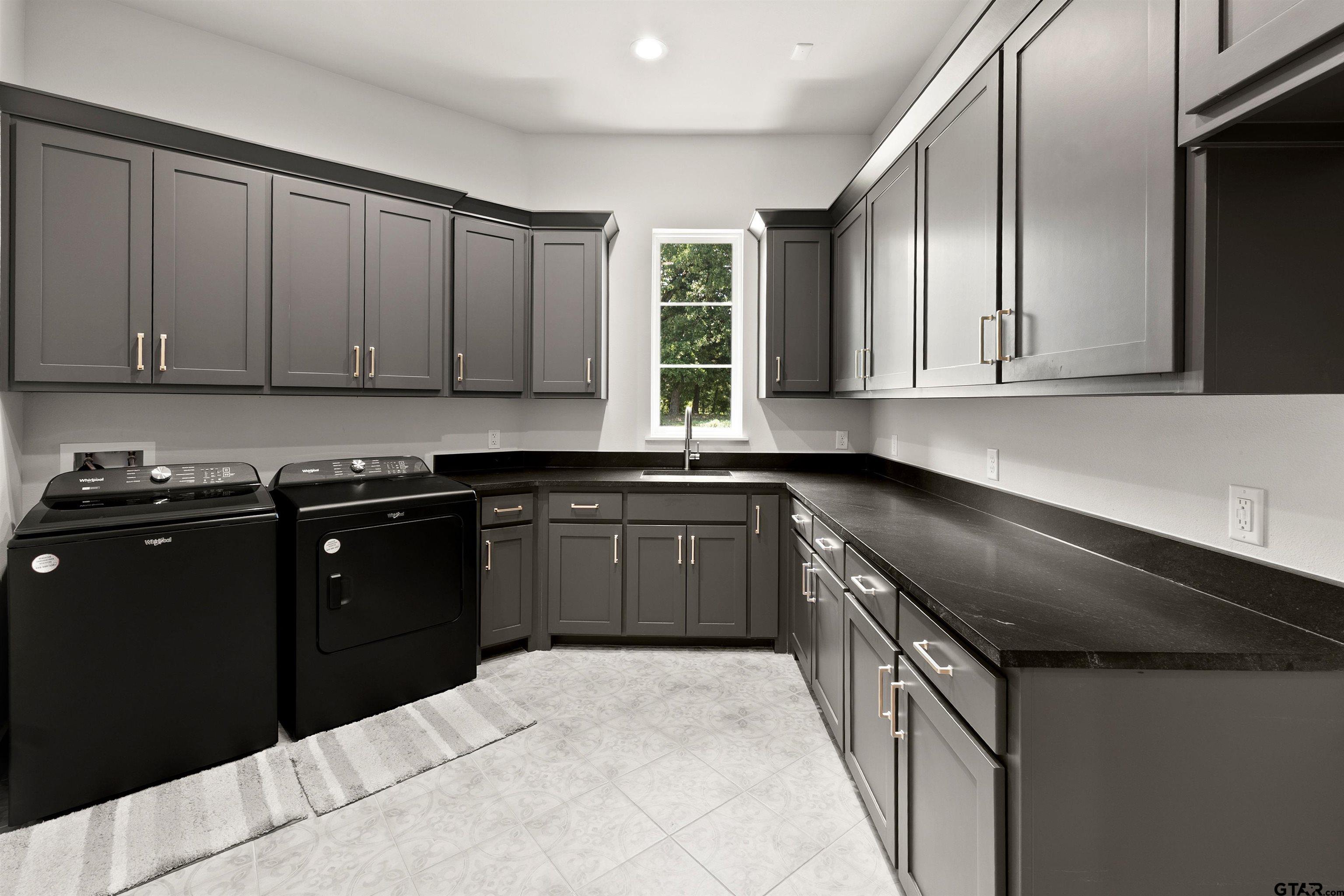 2895 Stewart Way Tyler, TX 75709 - Photo 13 of 44 a kitchen with granite countertop a sink and cabinets