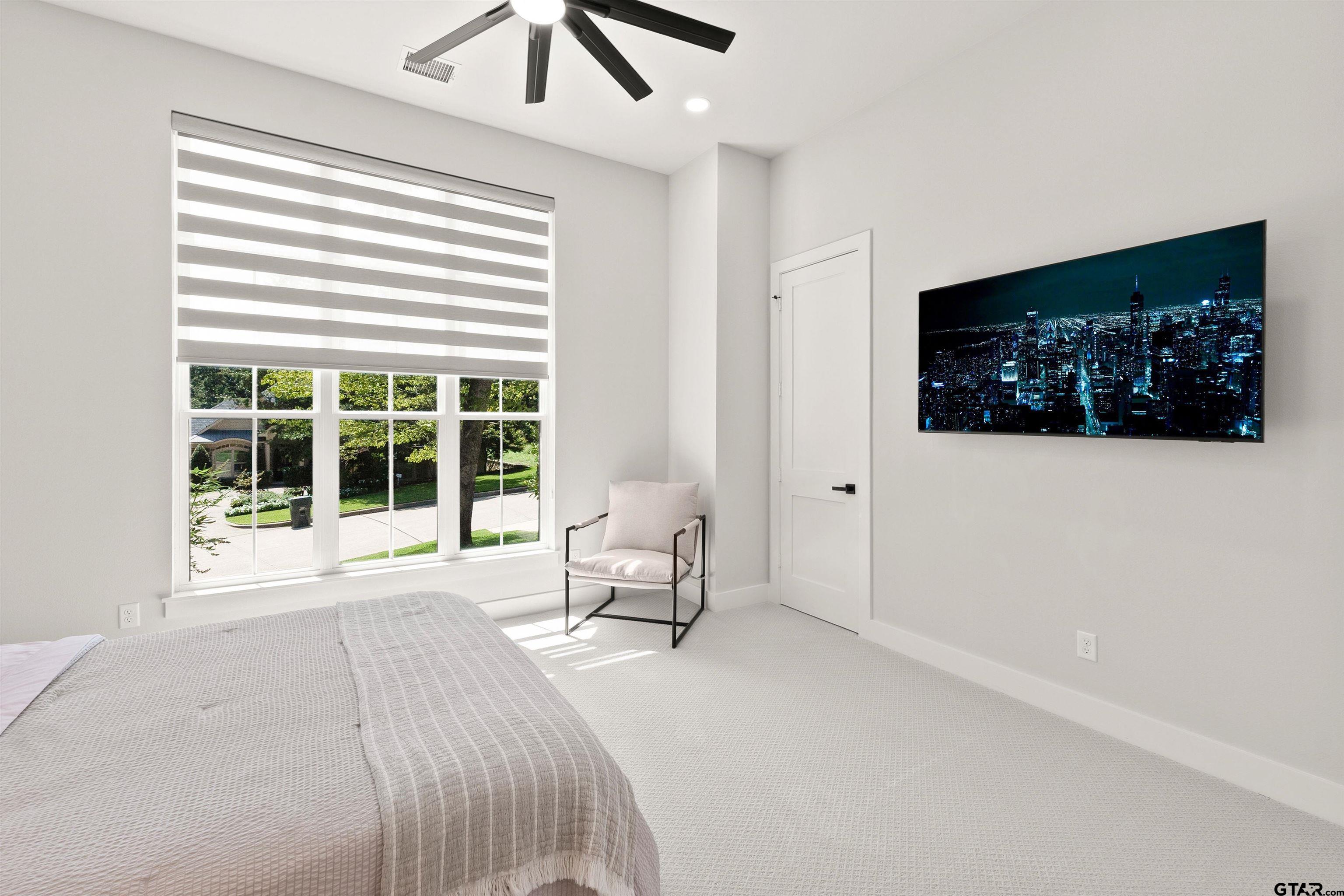 2895 Stewart Way Tyler, TX 75709 - Photo 17 of 44 a spacious bedroom with a large bed and a window