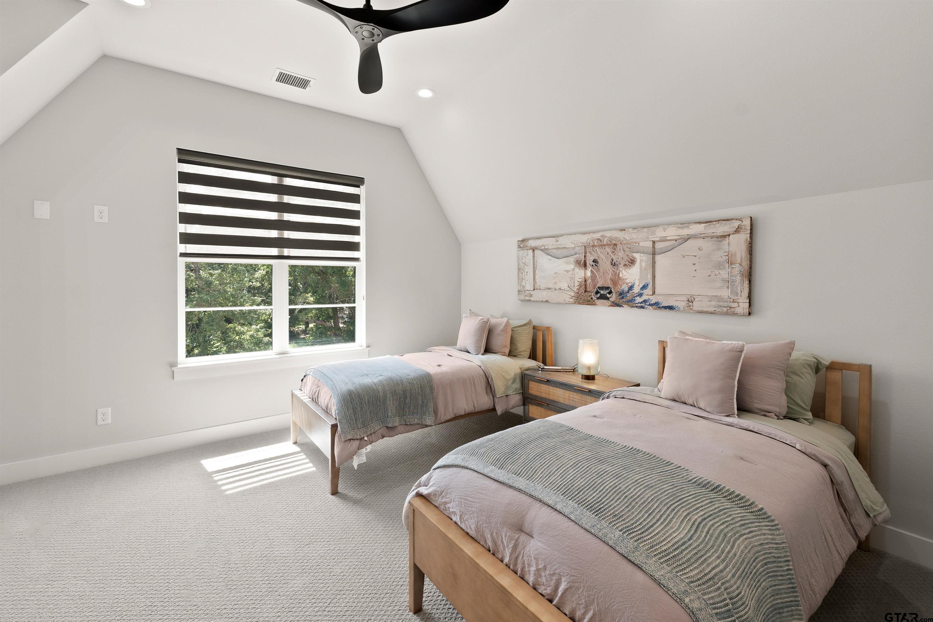 2895 Stewart Way Tyler, TX 75709 - Photo 21 of 44 a bedroom with two beds and a large window