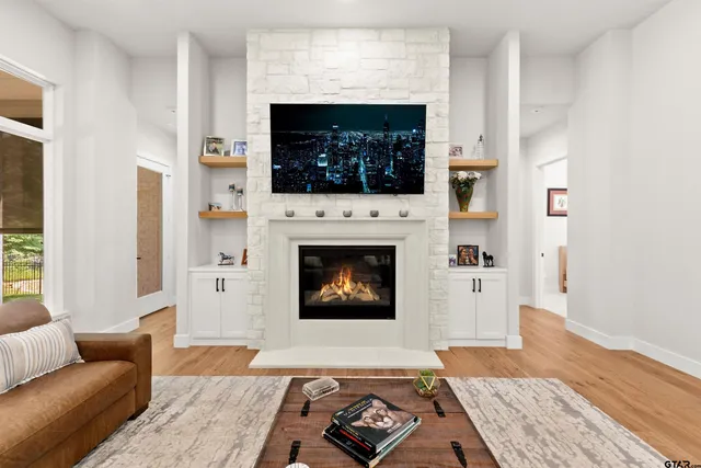 a living room with furniture and a fireplace