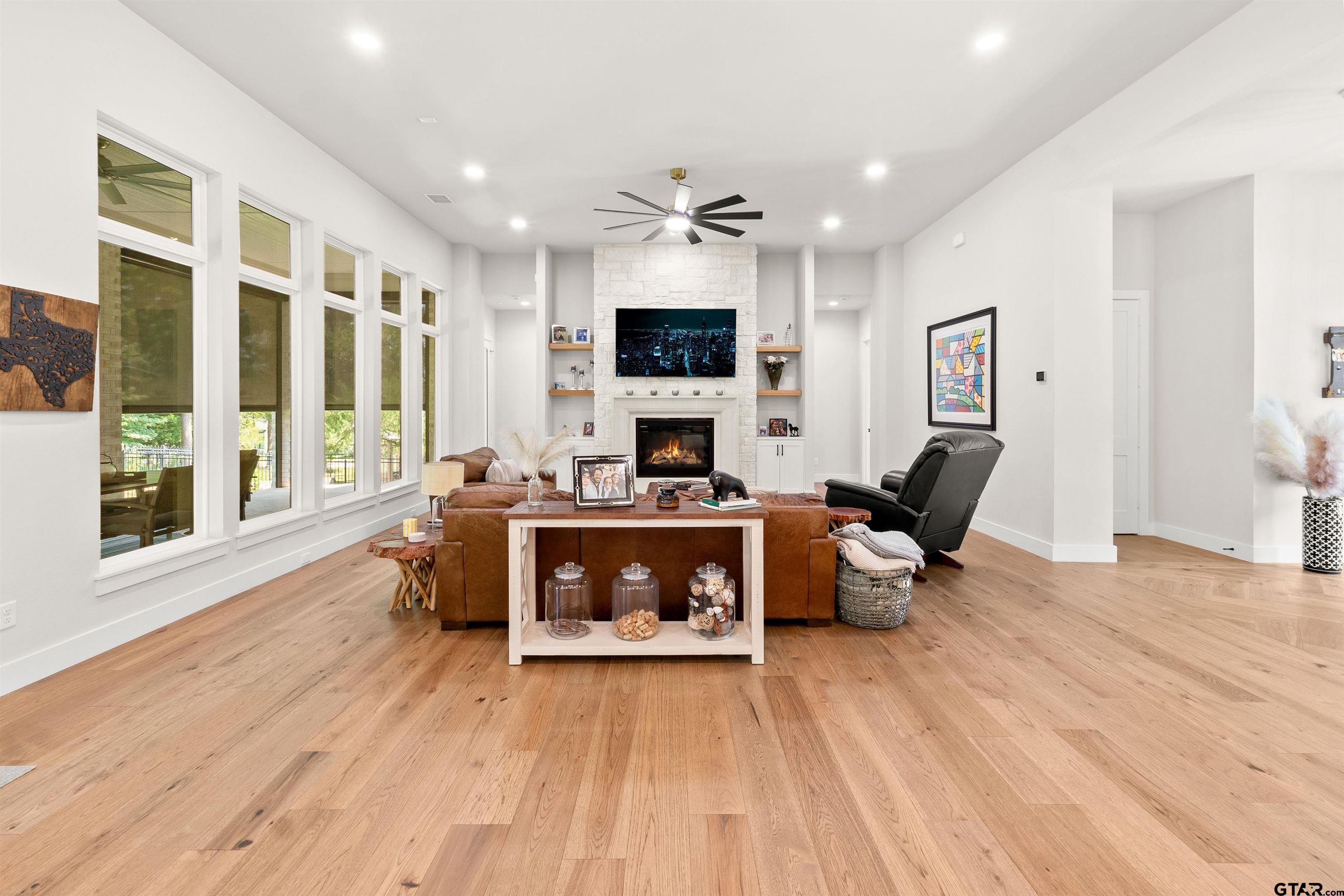 2895 Stewart Way Tyler, TX 75709 - Photo 5 of 44 a living room with furniture fireplace and flat screen tv
