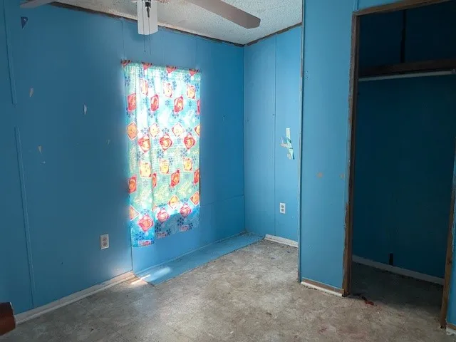an entryway with wooden floor and cabinet