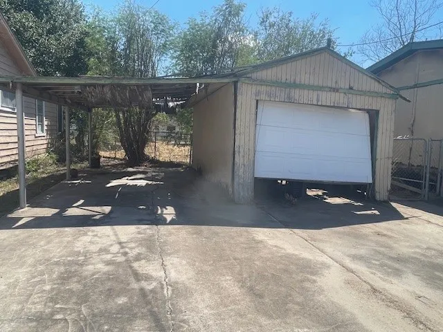 a view of a yard with snow on the road