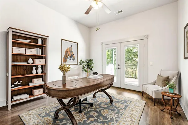 a view of a dining room with furniture and a window