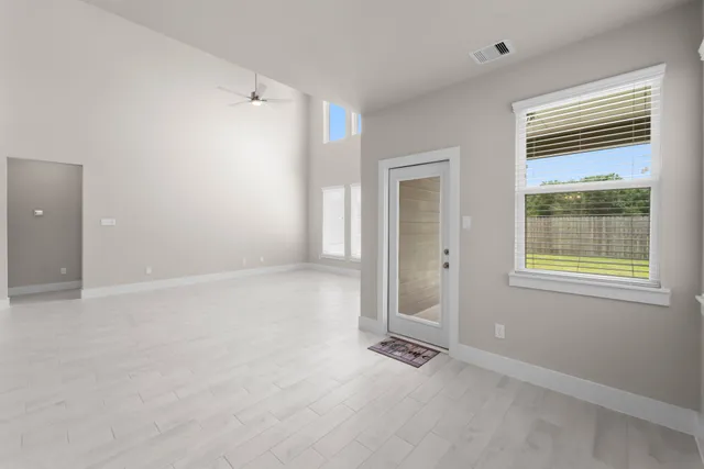 an empty room with windows