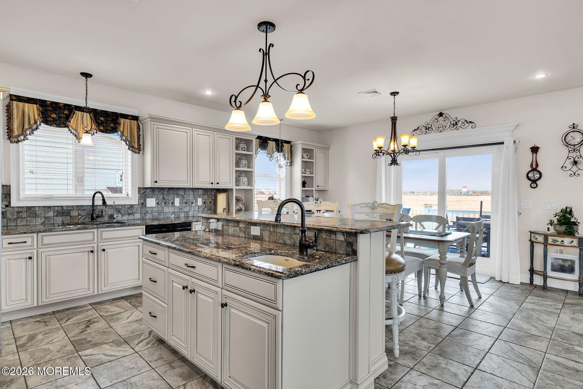 385 Kingfisher Road Tuckerton, NJ 08087 - Photo 11 of 58 a kitchen with center island table and chairs in it