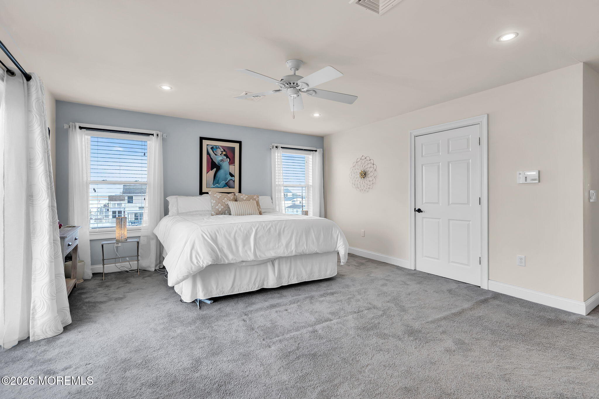 385 Kingfisher Road Tuckerton, NJ 08087 - Photo 25 of 58 a spacious bedroom with a bed and a chandelier