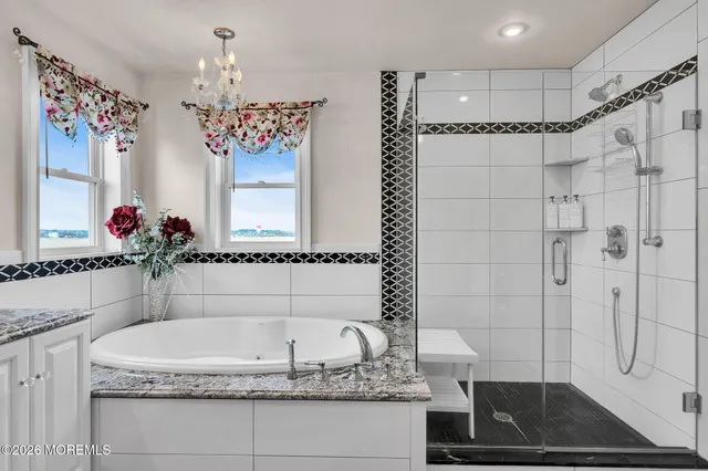 a view of a hallway with wooden floor and a bedroom