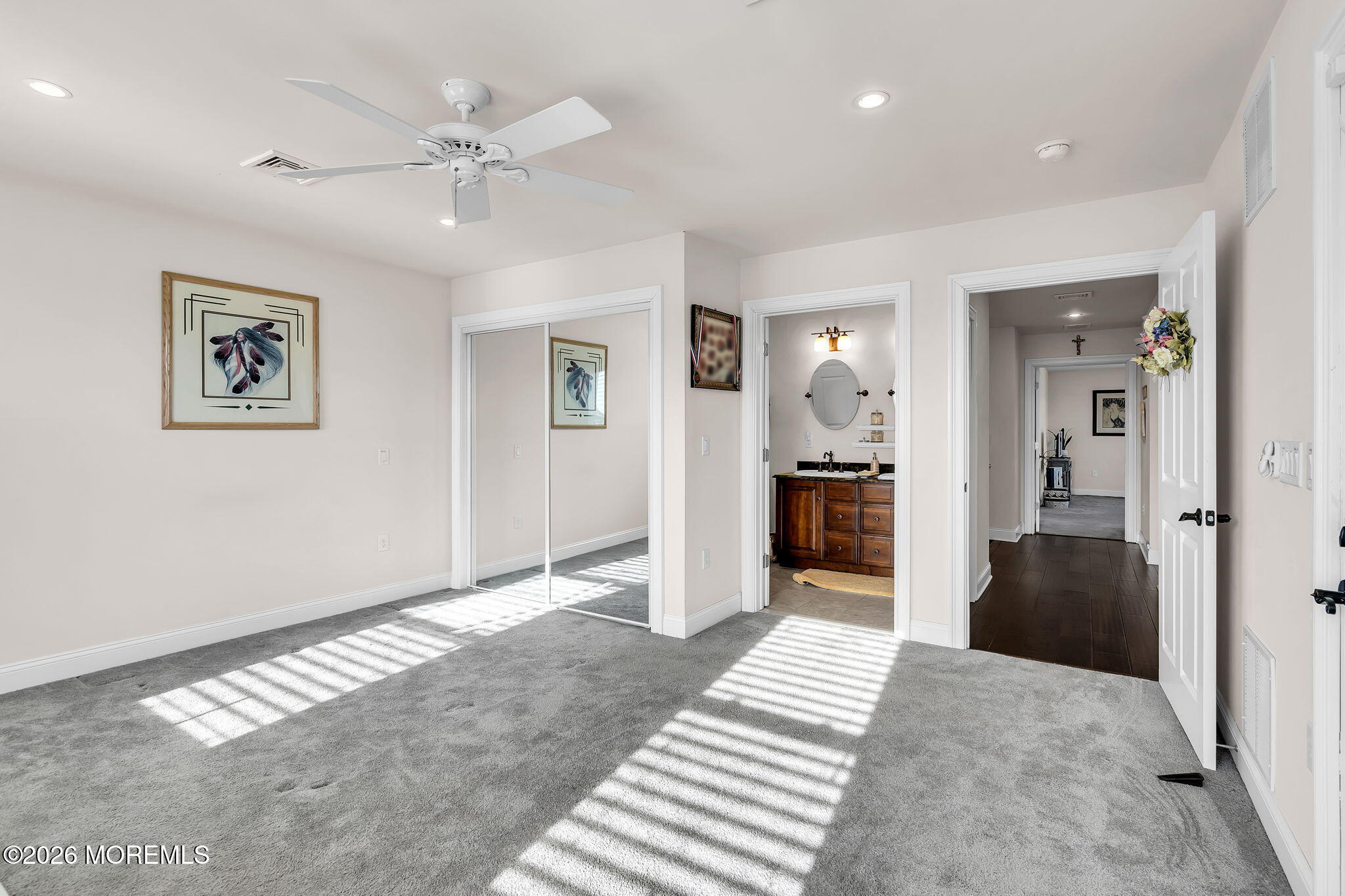 385 Kingfisher Road Tuckerton, NJ 08087 - Photo 32 of 58 a view of a hallway with wooden floor and a bedroom