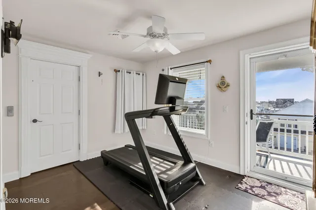 a view of an entryway with wooden floor
