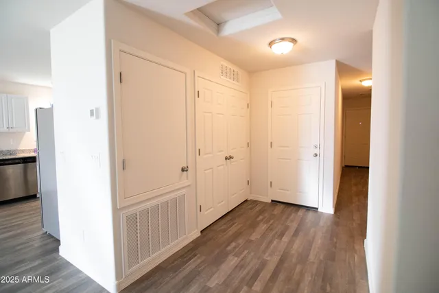 a bathroom with a granite countertop toilet sink and bathtub