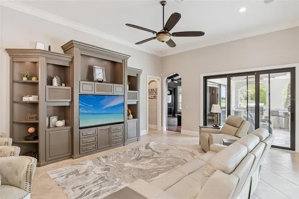 a living room with stainless steel appliances kitchen island granite countertop furniture and a kitchen view