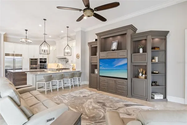 a view of a livingroom with furniture window and wooden floor