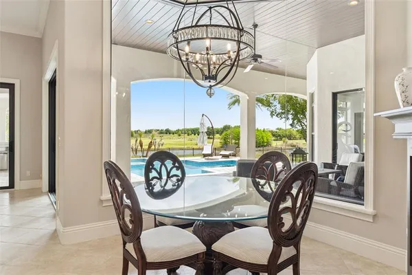 a kitchen with stainless steel appliances kitchen island granite countertop a sink a stove and a refrigerator