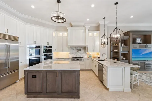 a living room with dining table and chairs