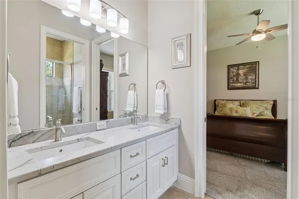 a bath tub sitting in a bathroom next to a window