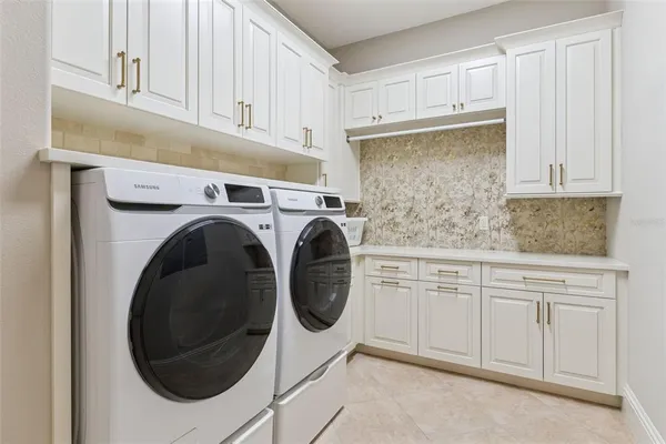a bedroom with a bed a window and dresser