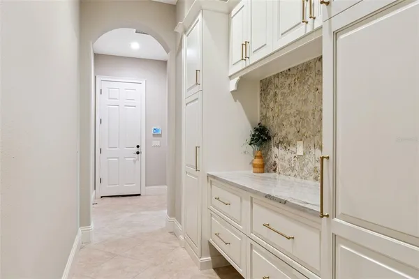 a building outdoor space with patio furniture and potted plants