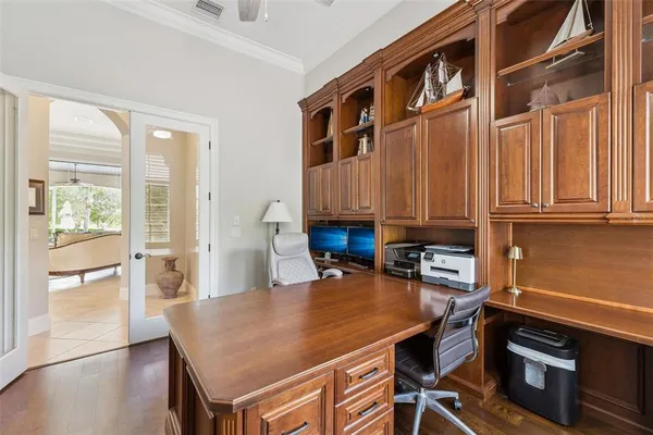 a view of a house with swimming pool and sitting area