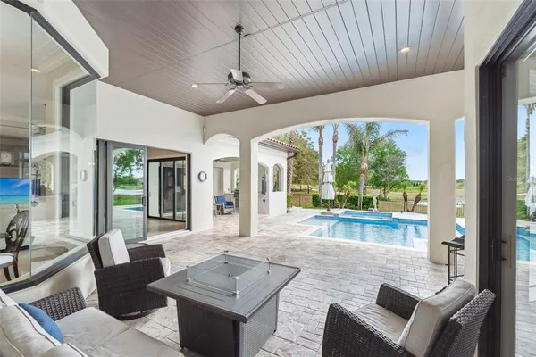 an aerial view of residential houses with outdoor space and street view