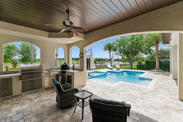 an aerial view of a house with outdoor space and street view