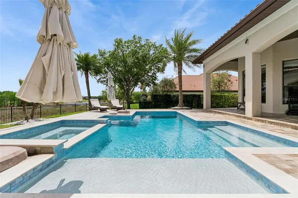 an aerial view of residential houses with outdoor space and street view
