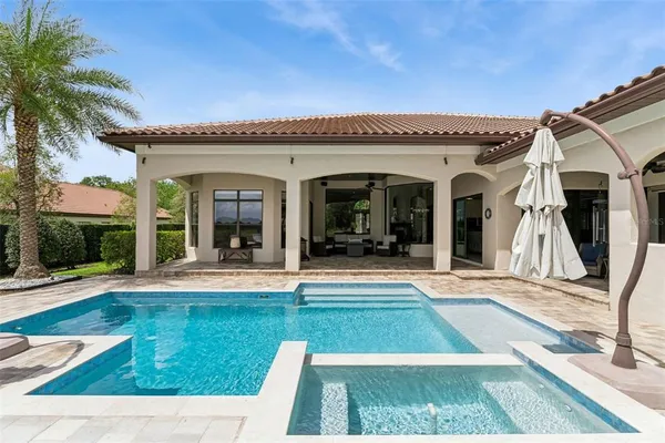 an aerial view of residential houses with outdoor space and street view