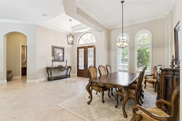 a living room with furniture a fireplace and a table