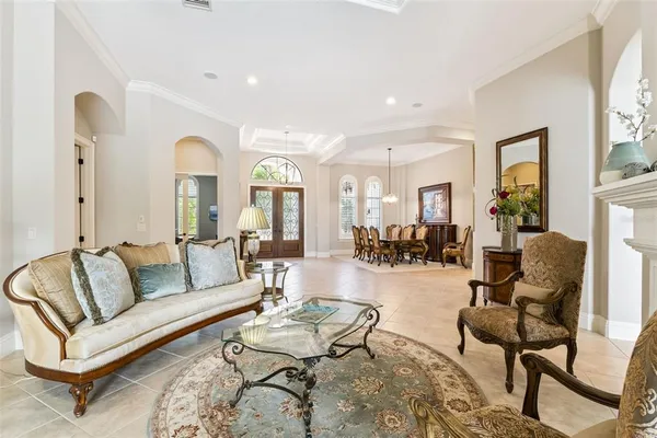a living room with furniture and a fireplace
