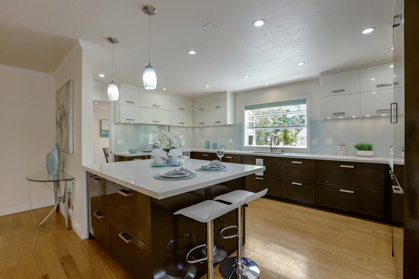 7949 Belknap Drive Cupertino, CA 95014 - Photo 3 of 8 a kitchen with a sink appliances and cabinets