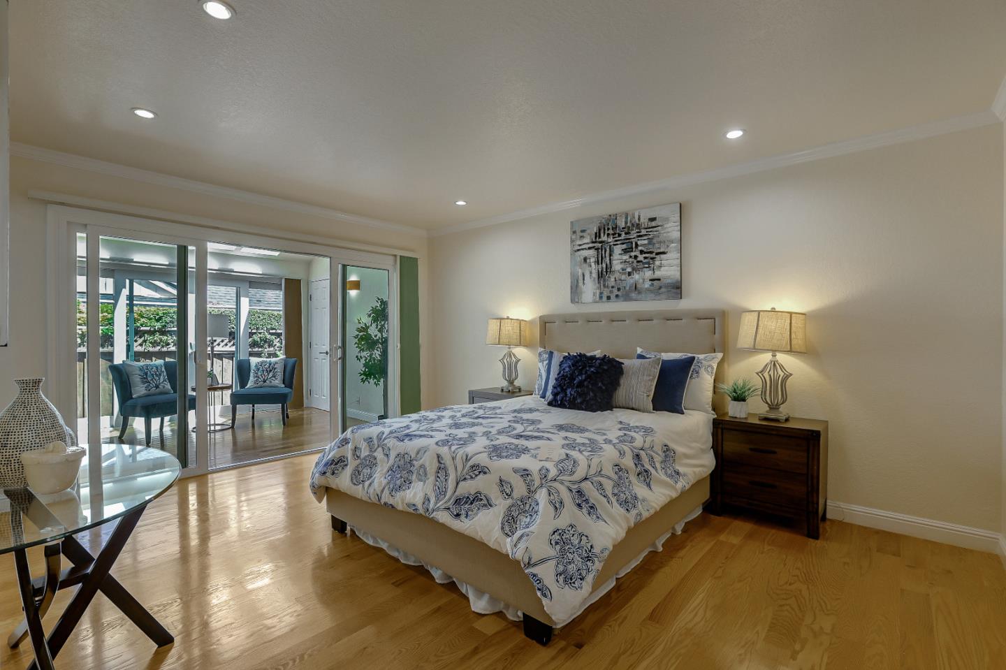 7949 Belknap Drive Cupertino, CA 95014 - Photo 6 of 8 a bedroom with a large bed and a night stand