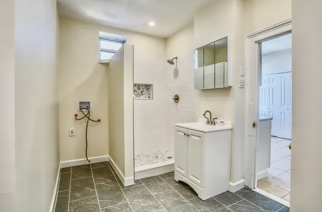 a bathroom with a sink and a mirror
