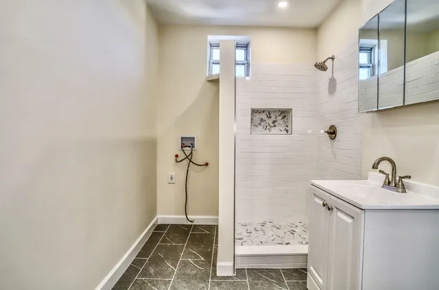 a bathroom with a sink and a mirror