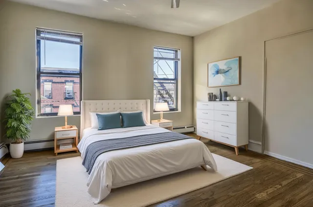 a bedroom with a bed and a dresser