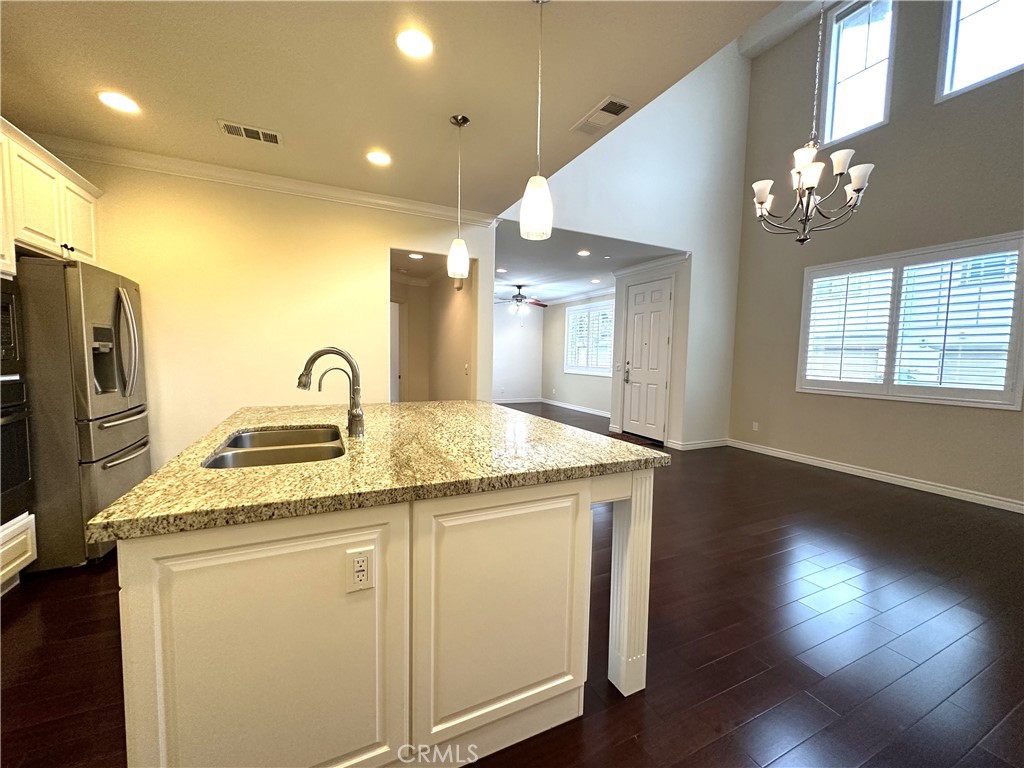 5076 Ruth Way Yorba Linda, CA 92886 - Photo 15 of 58 Kitchen Island Open to High Ceiling in Dining Area