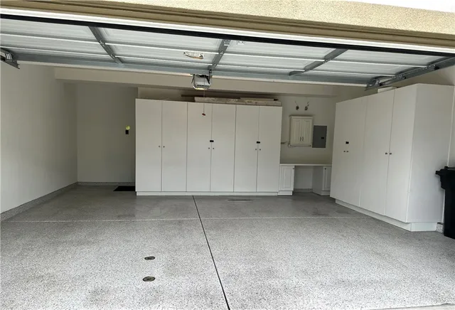 a view of a lake with a bench and wooden fence