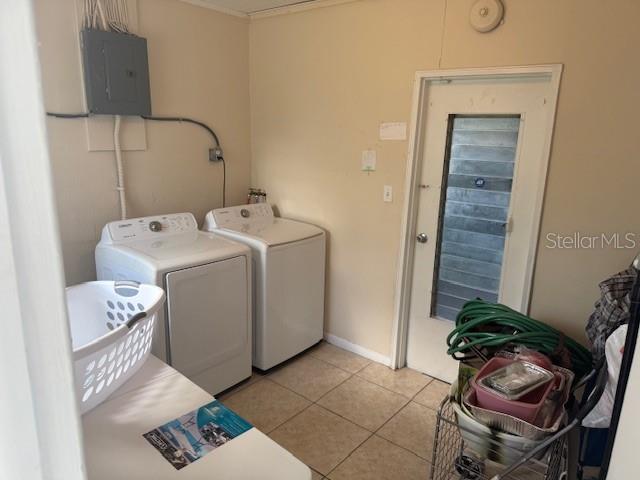 2108 Wolf Road Orlando, FL 32808 - Photo 12 of 14 a utility room with dryer and washer