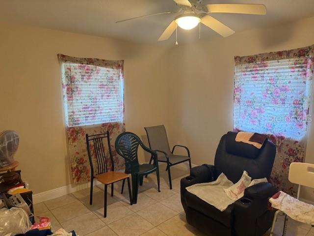 2108 Wolf Road Orlando, FL 32808 - Photo 5 of 14 a living room with furniture and a window