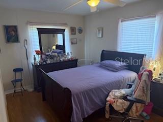 2108 Wolf Road Orlando, FL 32808 - Photo 6 of 14 a bedroom with a bed and a mirror