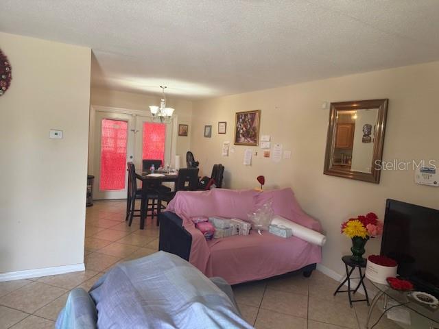 2108 Wolf Road Orlando, FL 32808 - Photo 10 of 14 a bedroom with furniture and a bed