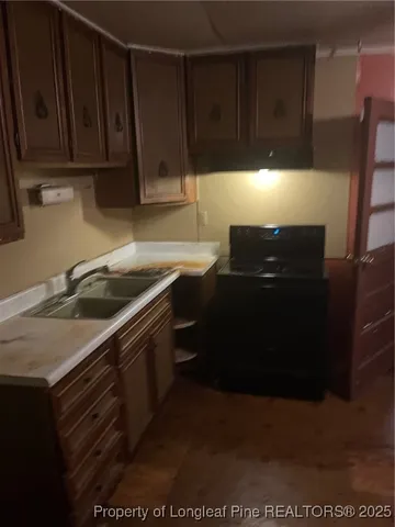 a kitchen with a sink and cabinets